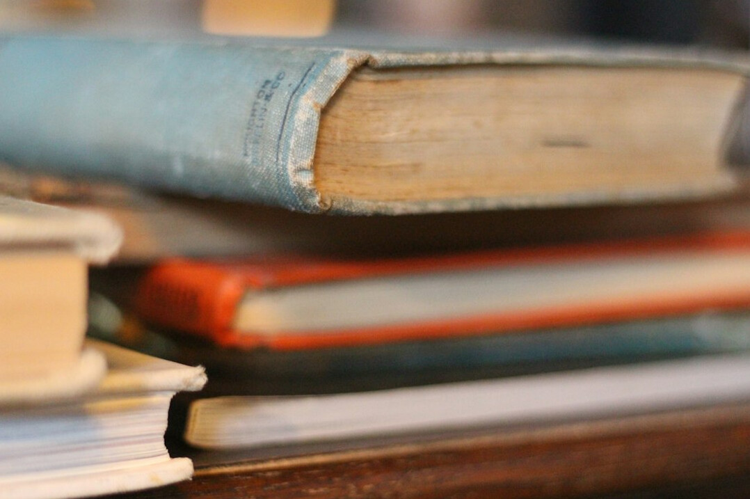 Stack of old books on a table